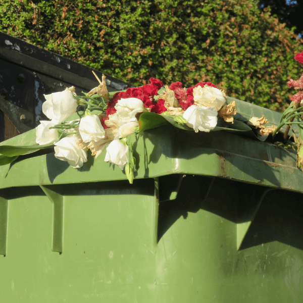 best residential dumpster rental - Things You Need to Know - a green dumpster filled with yard waste