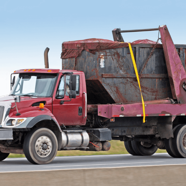 best residential dumpster rental - Things You Need to Know - a red truck with a full dumpster