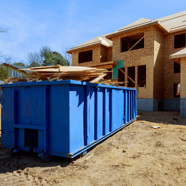 cheap 20 yard dumpster rental - Dumpster Rentals for Construction Projects - a 20-yard dumpster in front of a new home construction