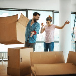 residential dumpster rental Kennesaw - 5 Tips For Renting A Dumpster For Your Move - a couple packing boxes for a move
