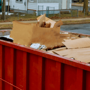 commercial dumpster rental Canton GA - How Long Can You Keep Your Dumpster - a red dumpster off the street in a residential neighbourhood